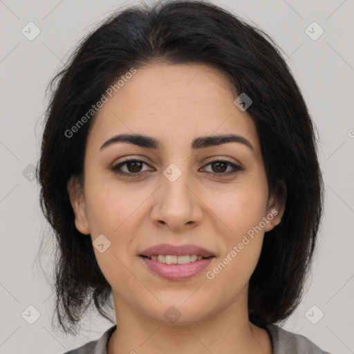 Joyful latino young-adult female with medium  brown hair and brown eyes