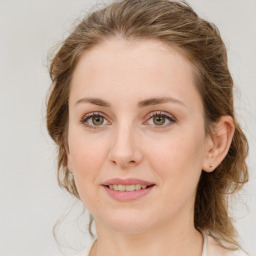 Joyful white young-adult female with medium  brown hair and green eyes