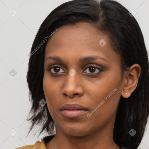 Joyful black young-adult female with medium  black hair and brown eyes