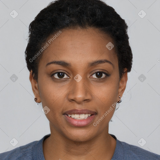 Joyful black young-adult female with short  black hair and brown eyes