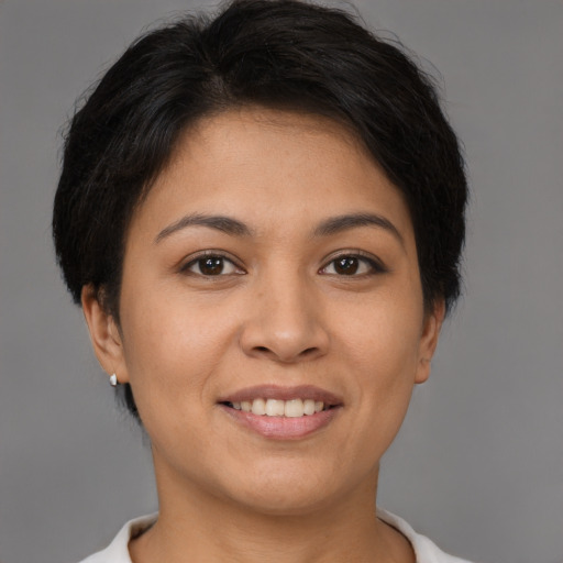 Joyful latino young-adult female with short  brown hair and brown eyes