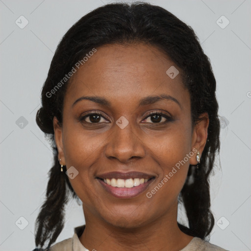 Joyful black adult female with medium  brown hair and brown eyes