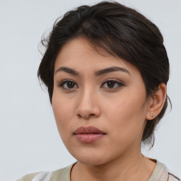 Neutral asian young-adult female with medium  brown hair and brown eyes