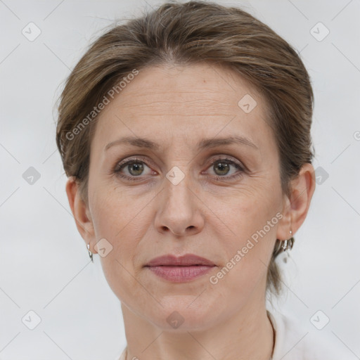 Joyful white adult female with short  brown hair and grey eyes