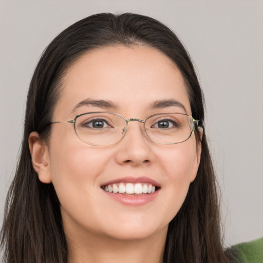 Joyful white young-adult female with long  brown hair and grey eyes