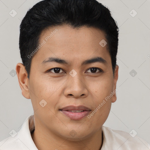 Joyful asian young-adult male with short  brown hair and brown eyes