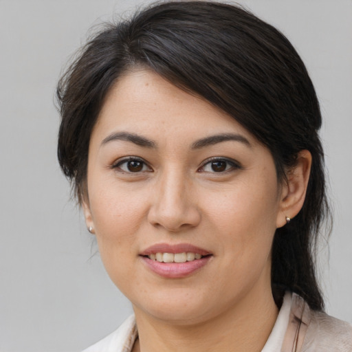 Joyful asian young-adult female with medium  brown hair and brown eyes