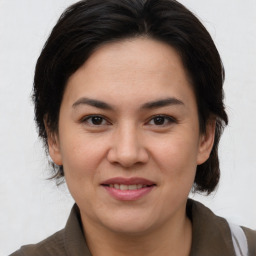 Joyful white adult female with medium  brown hair and brown eyes