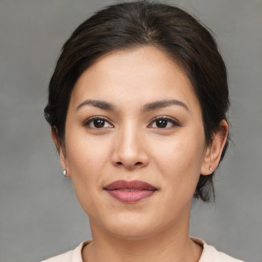 Joyful asian young-adult female with medium  brown hair and brown eyes