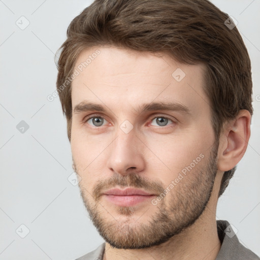 Neutral white young-adult male with short  brown hair and grey eyes