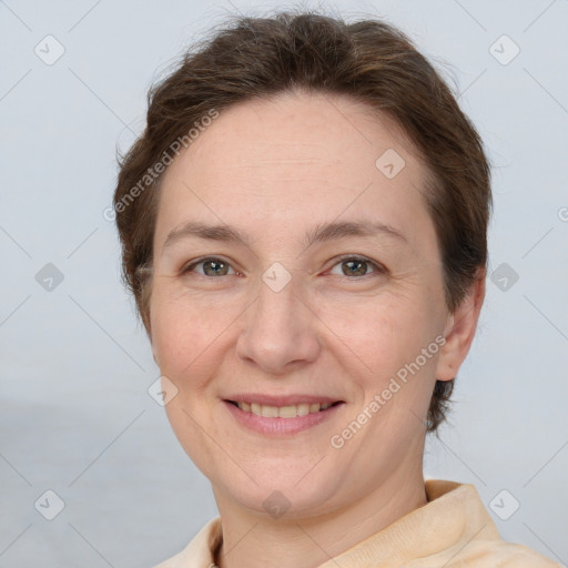 Joyful white adult female with short  brown hair and brown eyes