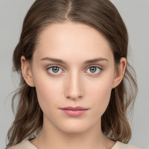 Neutral white young-adult female with medium  brown hair and brown eyes