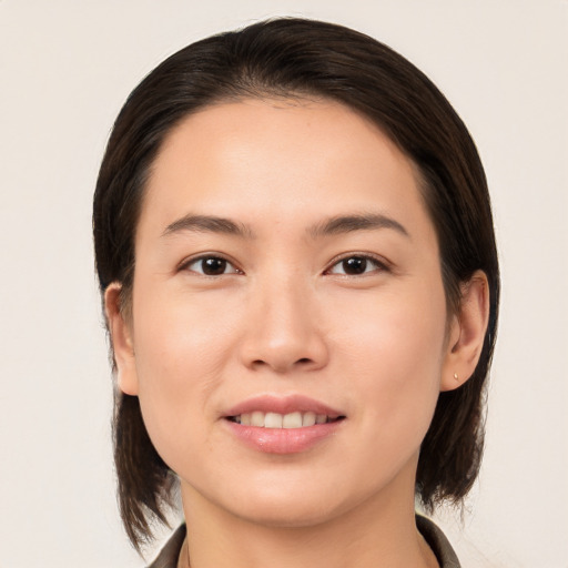 Joyful white young-adult female with medium  brown hair and brown eyes