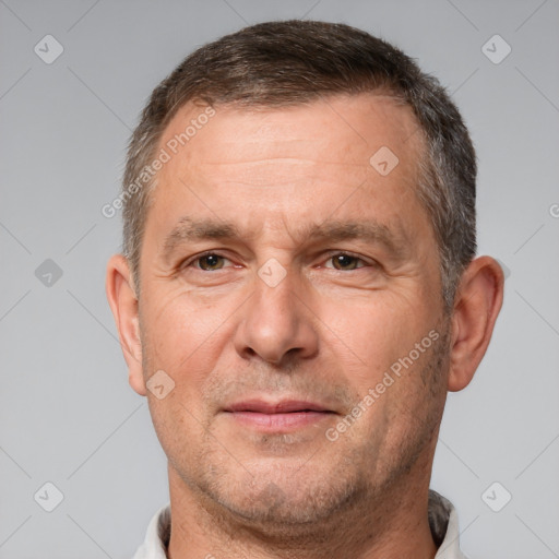 Joyful white adult male with short  brown hair and brown eyes