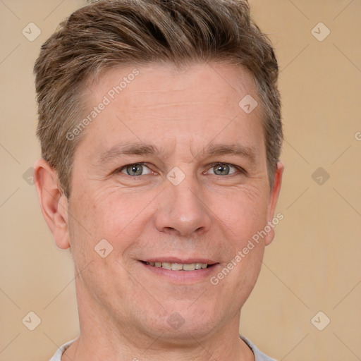 Joyful white adult male with short  brown hair and grey eyes