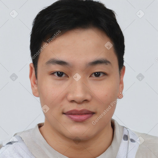 Joyful asian young-adult male with short  black hair and brown eyes