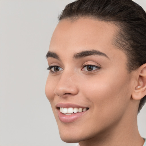 Joyful white young-adult female with short  brown hair and brown eyes