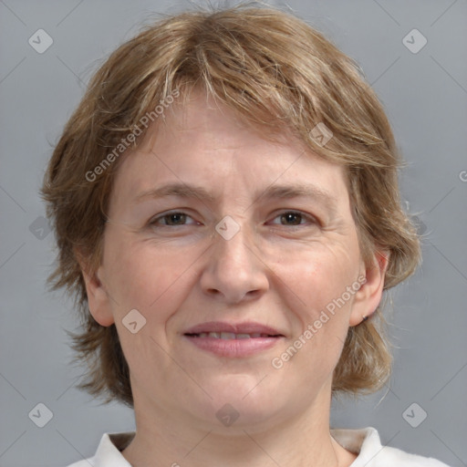 Joyful white adult female with medium  brown hair and grey eyes