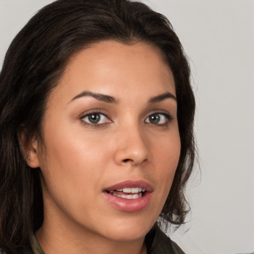 Joyful white young-adult female with medium  brown hair and brown eyes