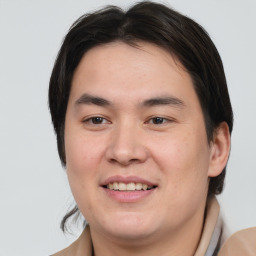 Joyful white young-adult male with medium  brown hair and brown eyes
