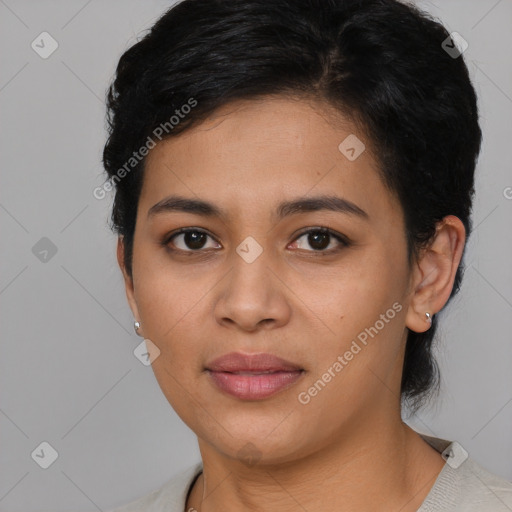 Joyful latino young-adult female with short  black hair and brown eyes