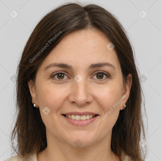 Joyful white adult female with medium  brown hair and brown eyes