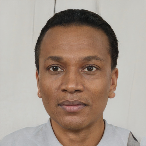 Neutral black adult male with short  black hair and brown eyes