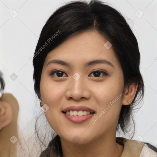 Joyful asian young-adult female with medium  black hair and brown eyes