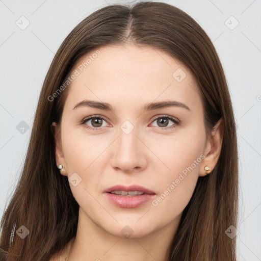 Neutral white young-adult female with long  brown hair and brown eyes