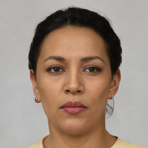 Neutral latino young-adult female with short  black hair and brown eyes