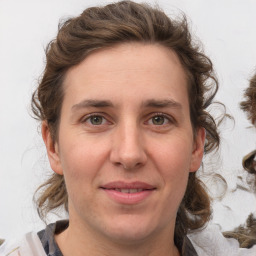 Joyful white adult female with medium  brown hair and brown eyes