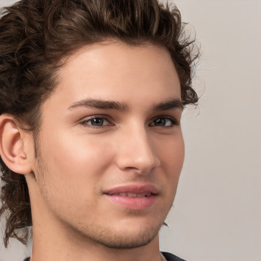 Joyful white young-adult male with medium  brown hair and brown eyes