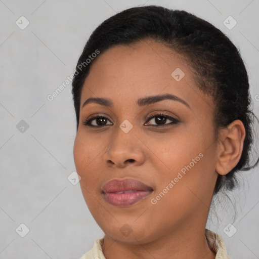 Joyful black young-adult female with medium  black hair and brown eyes