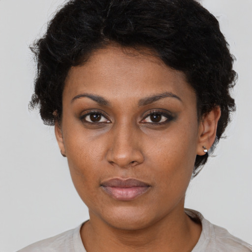 Neutral black young-adult female with short  brown hair and brown eyes