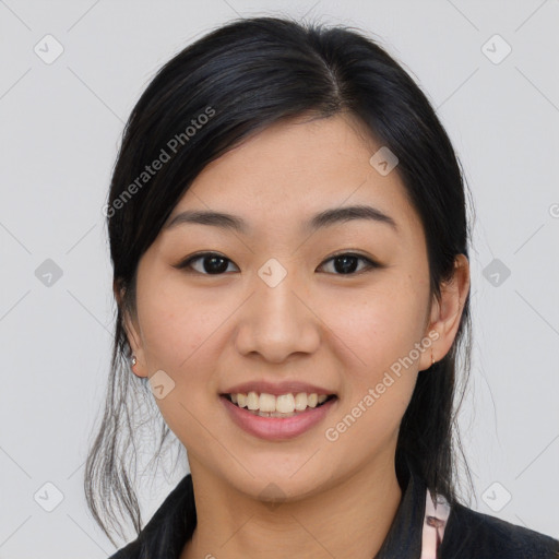 Joyful asian young-adult female with medium  black hair and brown eyes