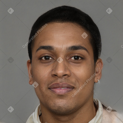 Joyful black young-adult male with short  brown hair and brown eyes