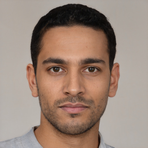 Neutral latino young-adult male with short  black hair and brown eyes