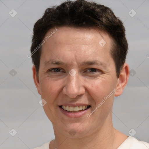 Joyful white adult male with short  brown hair and brown eyes