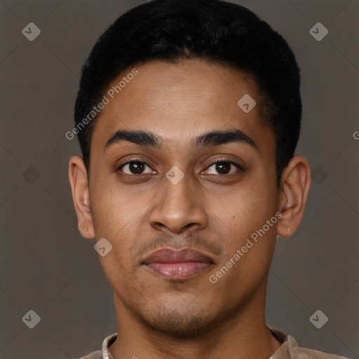 Joyful latino young-adult male with short  black hair and brown eyes