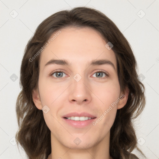 Joyful white young-adult female with long  brown hair and grey eyes