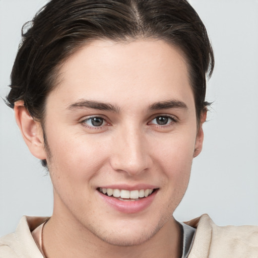 Joyful white young-adult female with short  brown hair and brown eyes