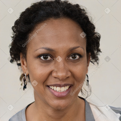 Joyful black adult female with short  brown hair and brown eyes