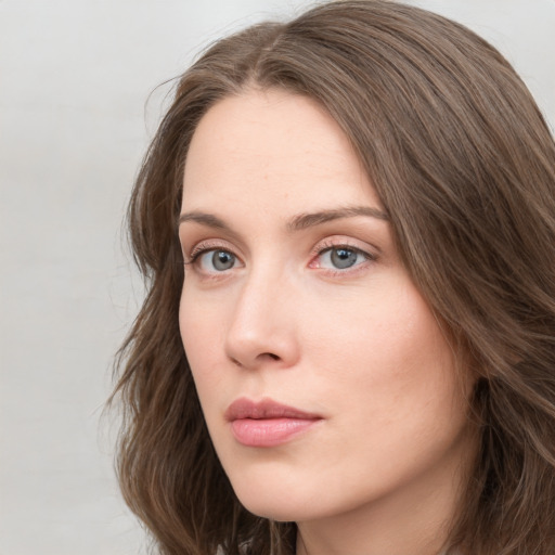 Neutral white young-adult female with long  brown hair and grey eyes