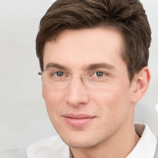 Joyful white adult male with short  brown hair and grey eyes