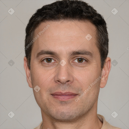 Joyful white adult male with short  black hair and brown eyes