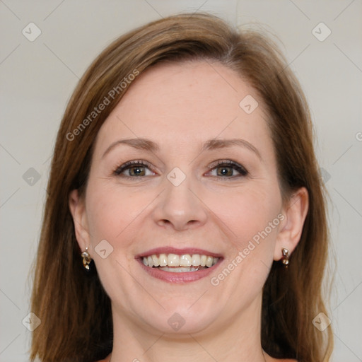 Joyful white adult female with medium  brown hair and grey eyes