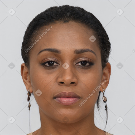 Joyful black young-adult female with short  brown hair and brown eyes