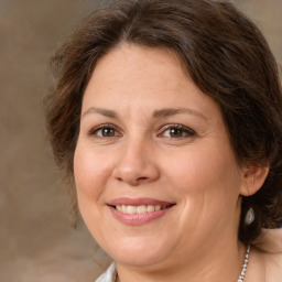 Joyful white adult female with medium  brown hair and brown eyes