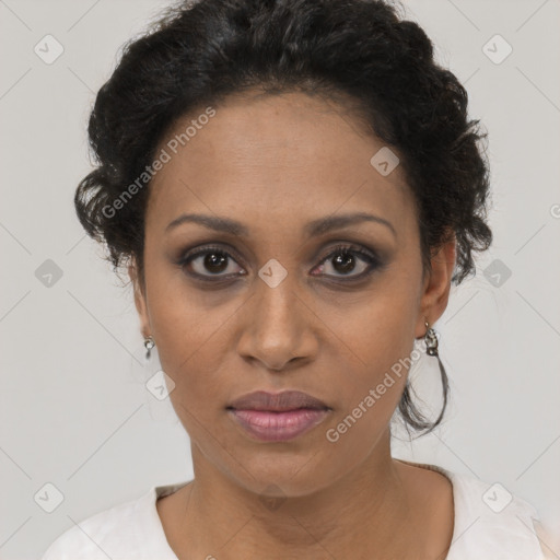 Joyful black adult female with short  brown hair and brown eyes