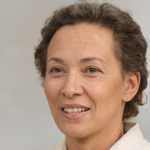 Joyful white adult female with short  brown hair and brown eyes